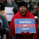 Alabamians stand outside the U.S. Supreme Court during arguments for Shelby County v. Holder. (Chip Somodevilla/Getty Images)